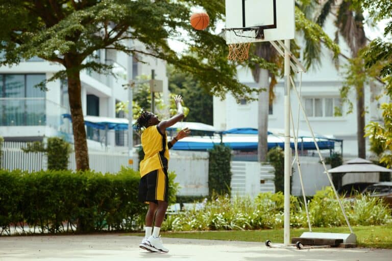 Black Man Playing Streetball Alone