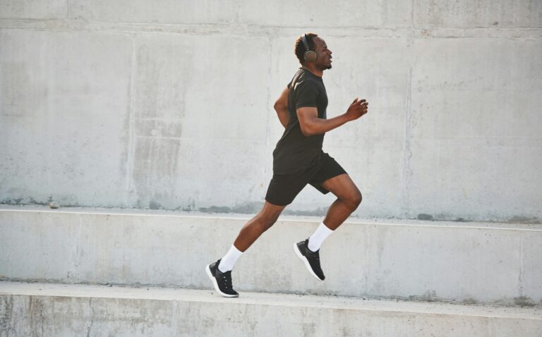 Sportive black man is running, morning routine