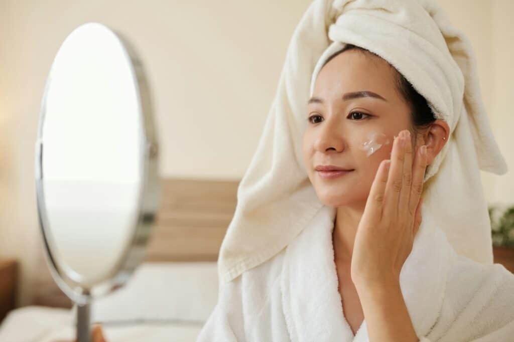 Woman Applying Anti-Aging Lotion